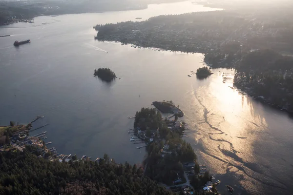 Aerial view of Deep Cove and Indian Arm during a Vibrant Sunset. Taken in Vancouver, British Columbia, Canada.