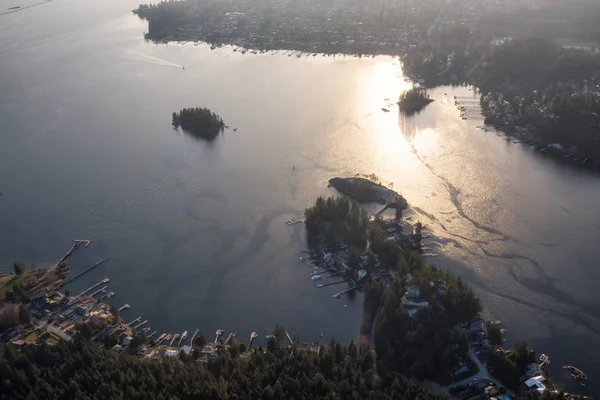 Aerial view of Deep Cove and Indian Arm during a Vibrant Sunset. Taken in Vancouver, British Columbia, Canada.