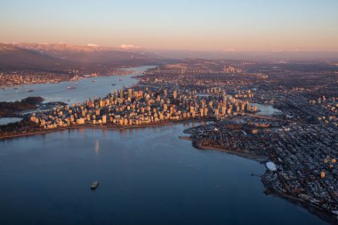 Aerial view of Downtown City during a vibrant sunset. Taken in Vancouver, British Columbia, Canada. clipart