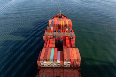 Vancouver, British Columbia, Canada - October 11, 2019: Aerial View from Above of a Cargo Ship arriving to the Port during a sunny evening.