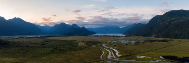 Beautiful Aerial Panoramic View of Canadian Mountain Landscape during a vibrant summer sunset. Taken near Pitt Lake, Near Vancouver, British Columbia, Canada.