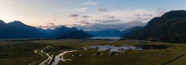 Beautiful Aerial Panoramic View of Canadian Mountain Landscape during a vibrant summer sunset. Taken near Pitt Lake, Near Vancouver, British Columbia, Canada.