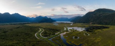 Beautiful Aerial Panoramic View of Canadian Mountain Landscape during a vibrant summer sunset. Taken near Pitt Lake, Near Vancouver, British Columbia, Canada.