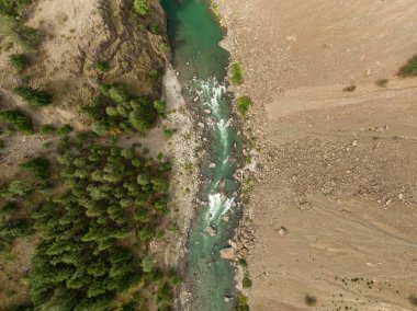Aerial View from Above of a beautiful Green River running in the valley during a summer day. Taken near Lillooet, British Columbia, Canada.