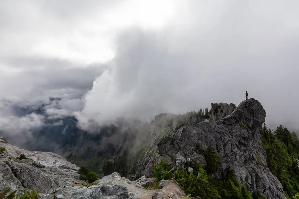 Adventurous Man Standing Top Rugged Rocky Mountain Cloudy Summer Morning — Stock Photo, Image