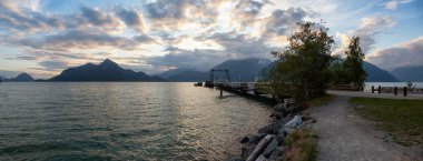 Beautiful Panoramic View of Howe Sound surrounded by Canadian Mountain Landscape during summer sunset. Taken in Porteau Cove, North of Vancouver, BC, Canada. clipart