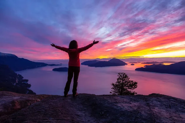 stock image Adventurous Caucasian Girl standing on top of a mountain