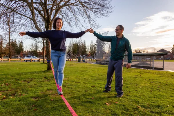 People Slacklining in the Park — 스톡 사진