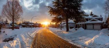 Residential Neighborhood in the Suburbs during a Dramatic Colorful Sunrise