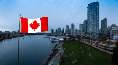 Canadian Flag. Downtown Vancouver, British Columbia, Canada. Beautiful Aerial Panoramic View of Modern City Buildings in False Creek during a colorful blue hour Sunset. Panorama clipart