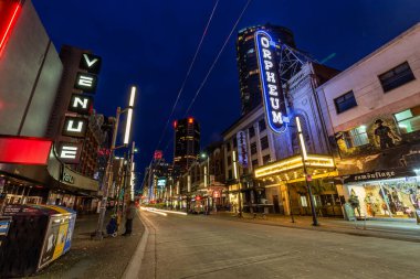 Downtown Vancouver, British Columbia, Canada - Feb 22, 2020: Night View of a Main Strip in the Modern Urban City, Granville St, where most nightclubs are located.