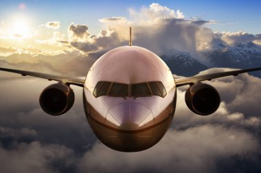 Renkli günbatımında ya da gündoğumunda bulutların üzerinde uçan uçak. Seyahat, ulaşım, havacılık, yolculuk, macera kavramı