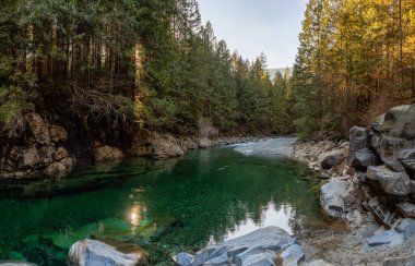 Beautiful Panoramic View of the river in the Canadian Mountain Landscape during a sunny winter day. Taken in Golden Ears Provincial Park, near Vancouver, British Columbia, Canada. clipart