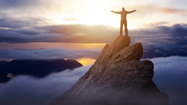 Cinemagraph Continuous Loop Animation of Adventurous Man on top of Mountain Cliff — Stock Video