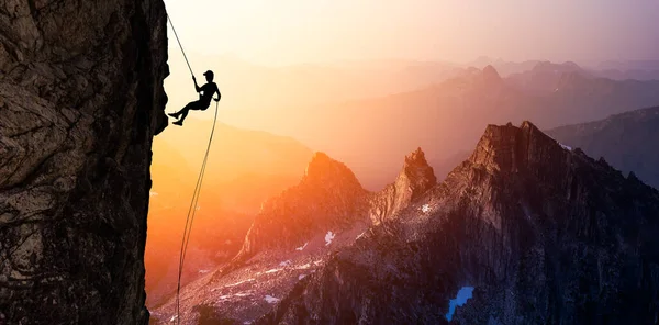 Silhouette Rappelling from Cliff — Stock Photo, Image