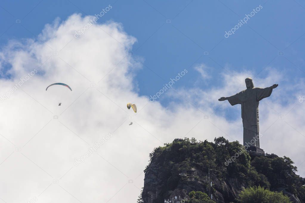 Paragliding pilots over Cristo Redentor Statue