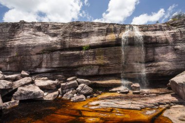 Beautiful natural waterfall on rocky landscape, Chapada Diamantina, Bahia, Brazil clipart