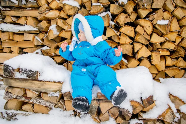 Baby Boy Sitting Stack Firewood Winter Snow — Stock Photo, Image