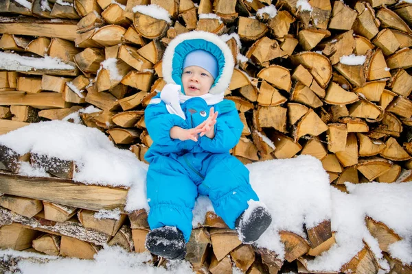 Baby Boy Sitting Stack Firewood Winter Snow — Stock Photo, Image