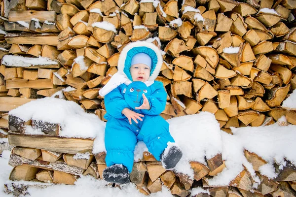 Baby Boy Sitting Stack Firewood Winter Snow — Stock Photo, Image