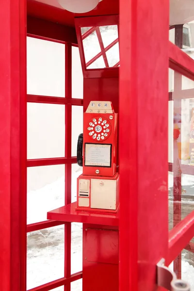 Red telephone box in the park — Stock Photo, Image