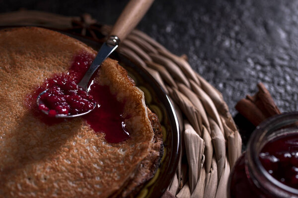Traditional thin pancakes served with jam.