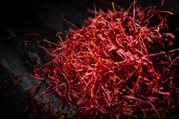 Saffron threads on dark background — Stock Photo, Image