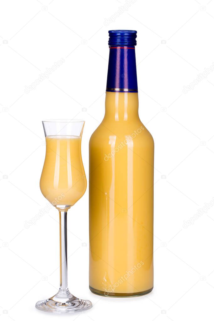 Bottle and glass of egg liqueur isolated on white background
