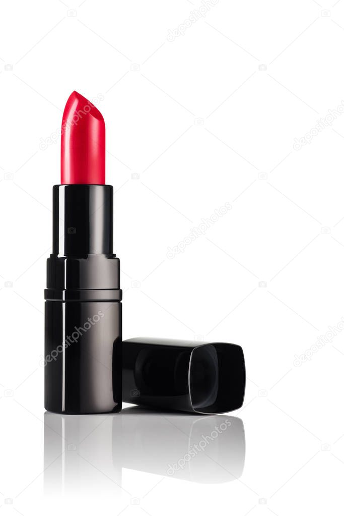 Red lipstick on white, reflective, mirror background.