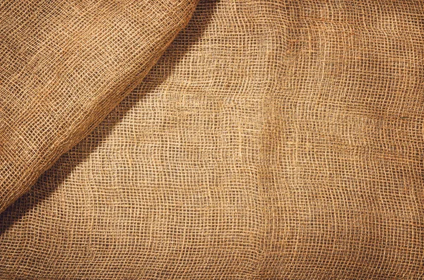 Linen jute fabric background. Visible texture