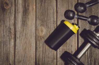 Fitness Egzersiz arka plan. Halter ahşap spor salonu kat veya tablo