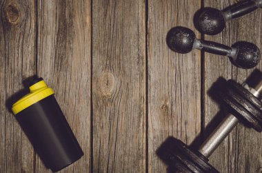 Fitness Egzersiz arka plan. Halter ahşap spor salonu kat veya tablo