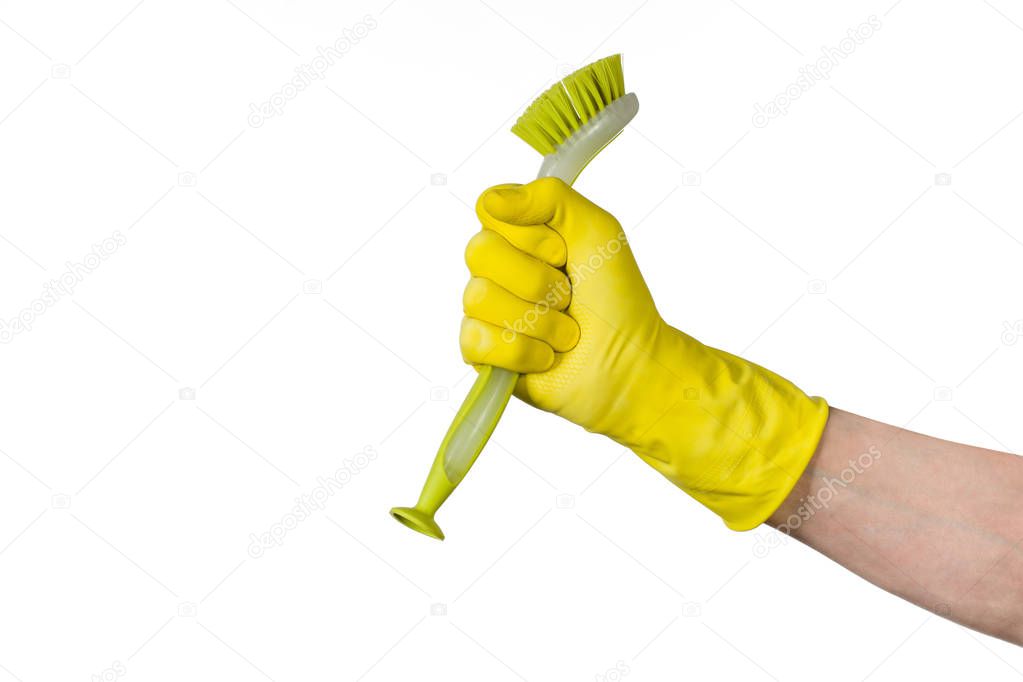 Hand with cleaning brush isolated on white background