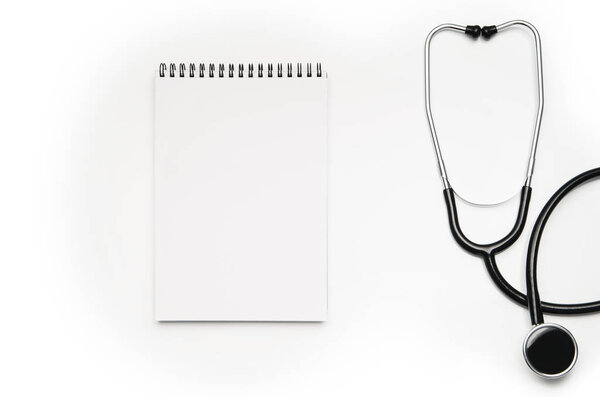 Stethoscope isolated on white background. Top view photograph