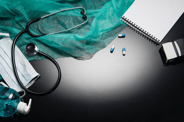 Doctors desk with medical accessories and products. Top view photograph