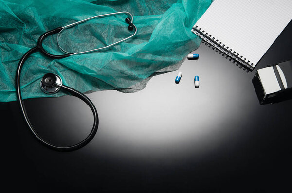 Doctors desk with medical accessories and products. Top view photograph