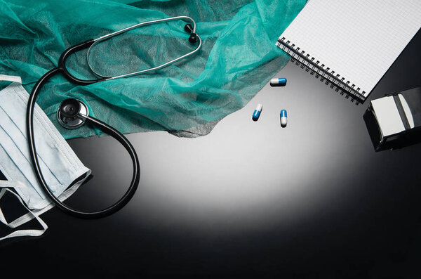 Doctors desk with medical accessories and products. Top view photograph