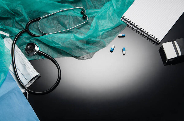 Doctors desk with medical accessories and products. Top view photograph