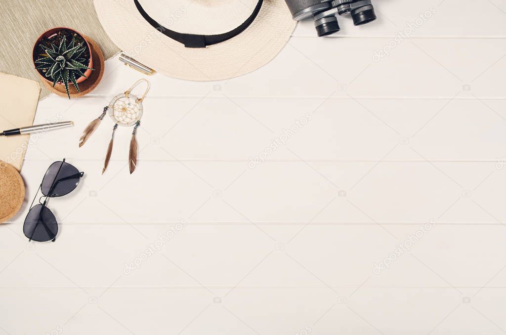 Accessories for travel top view on white wooden background frame