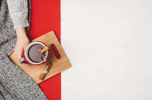Hand holding cup of tea. Top view with copy space — Stock Photo, Image