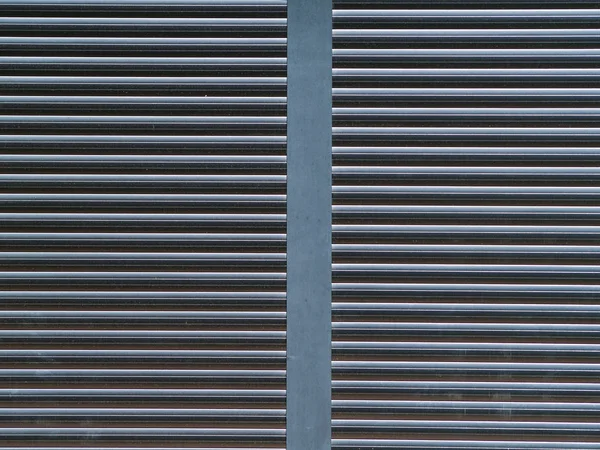 Textuur van een grijze blind op een huis — Stockfoto