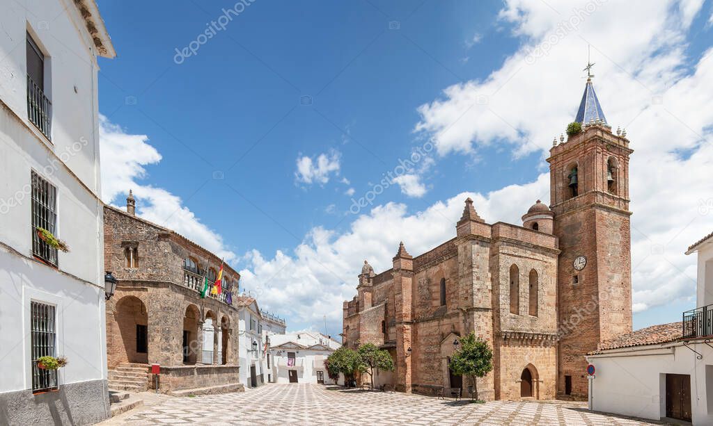 View of Church of the Immaculate Conception (Iglesia de la Inmaculada Concepcion) in the village of Zufre with a beautiful old style hanging lamp in the foreground, Huelva mountains, Spain.