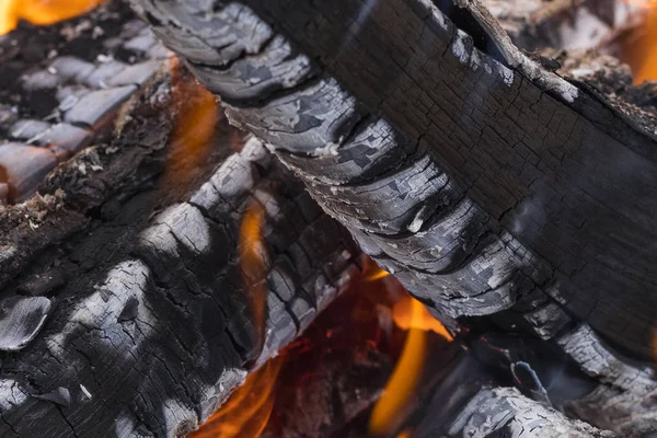 The texture of firewood in the flame — Stock Photo, Image