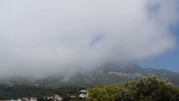 Tre bilder av moln i dalen — Stockvideo
