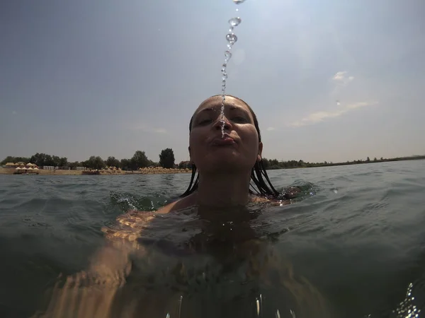 Young Woman Spits Camera While Swimming Water Spitting Water — Stock Photo, Image