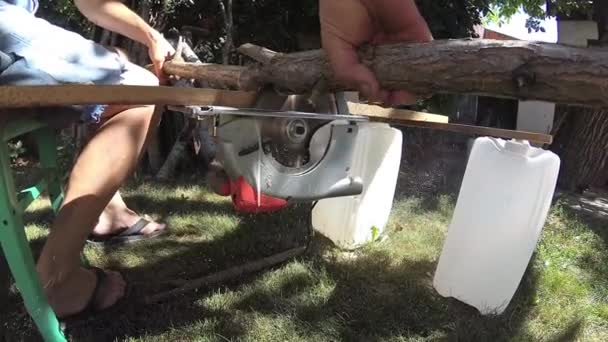 Man Cutting Wood Branches Making Them Firewood — Stock Video