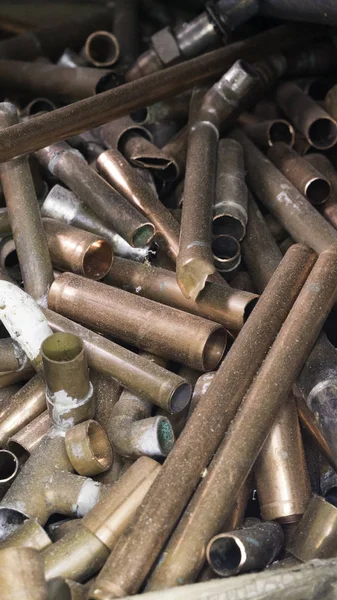 Chopped dusty copper tubes. Scrap metal.  Copper tube scrap.