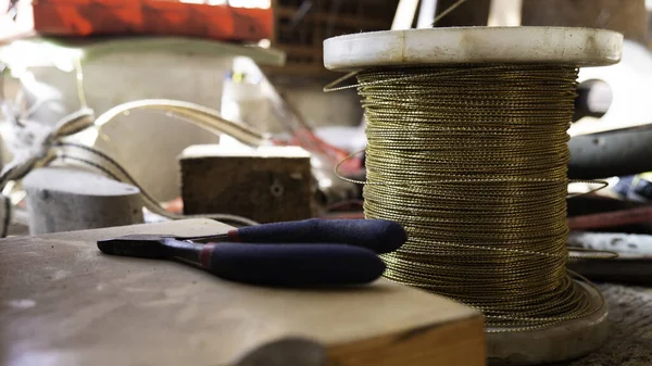 Copper wire winding in workshop