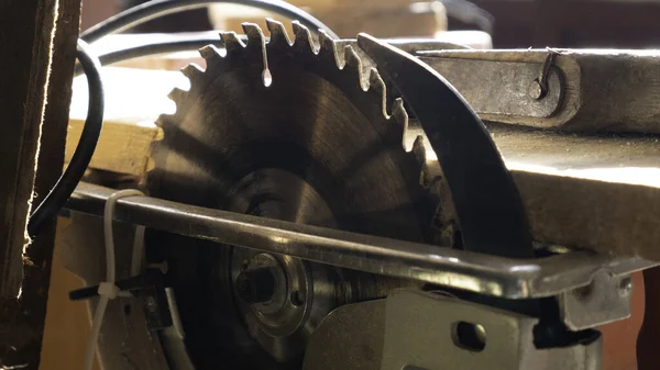 Table saw cutting wood. Saw blades made of steel for various cutting jobs.