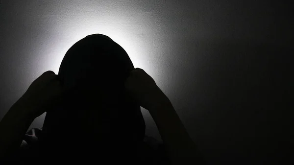 Silhouette of worried depressed person.